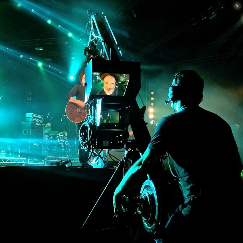 Operating the Jimmy Jib at a live concert, with the guitarist on stage under lighting