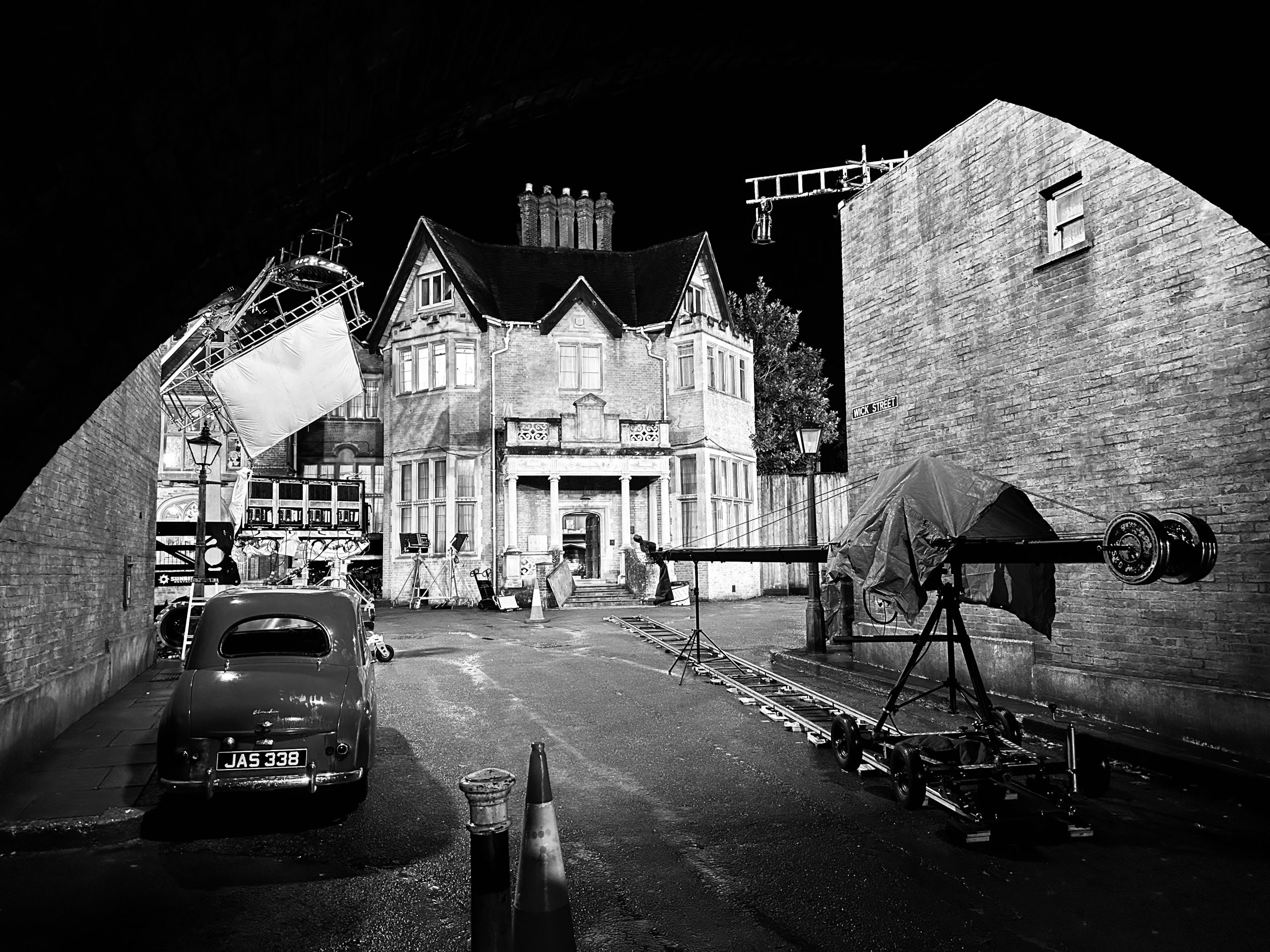 Nonnatus House lit at night with camera track laid and the jib rigged