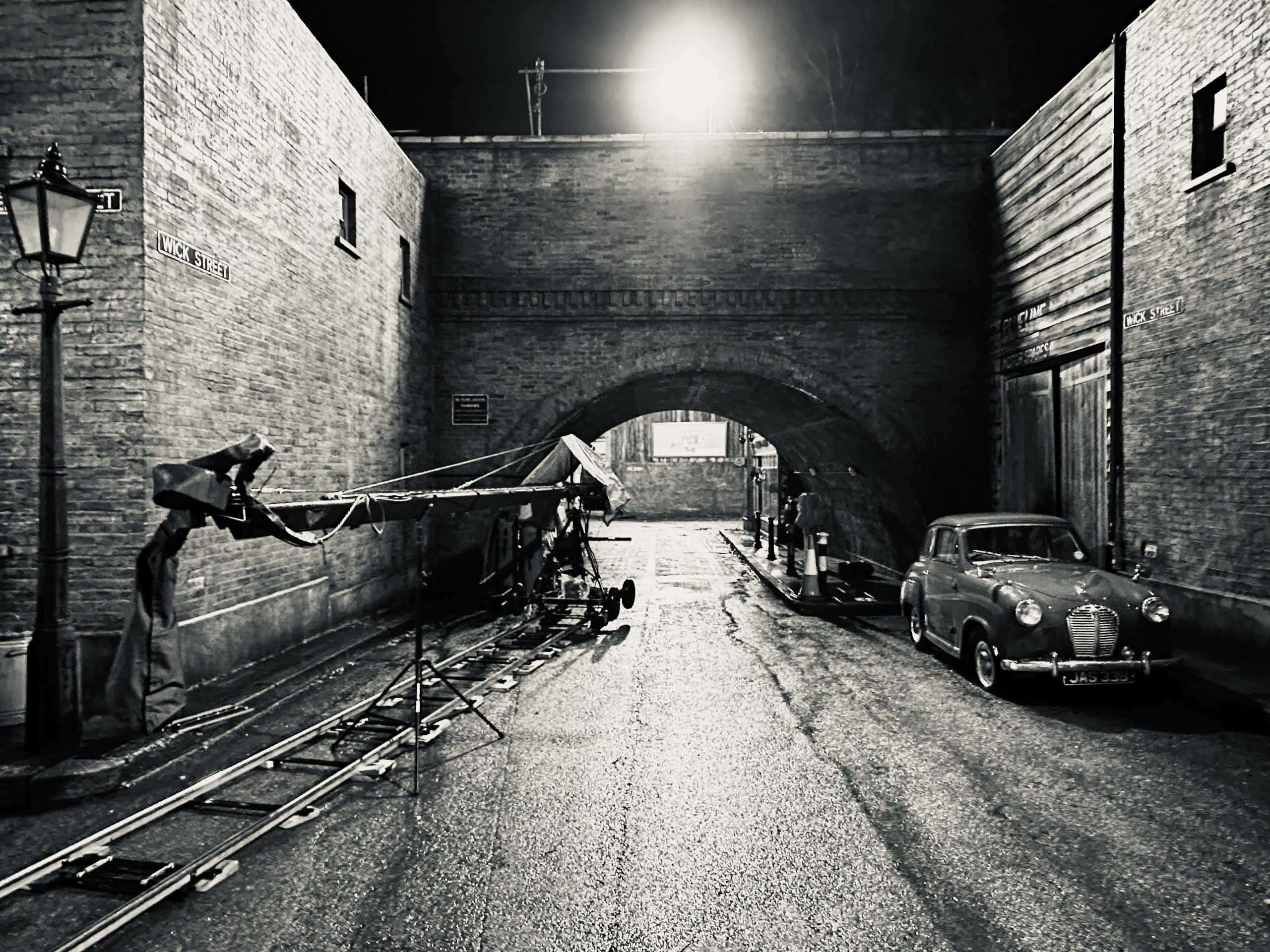 Jimmy Jib rigged on track beneath the railway arch on the Call the Midwife backlot at night
